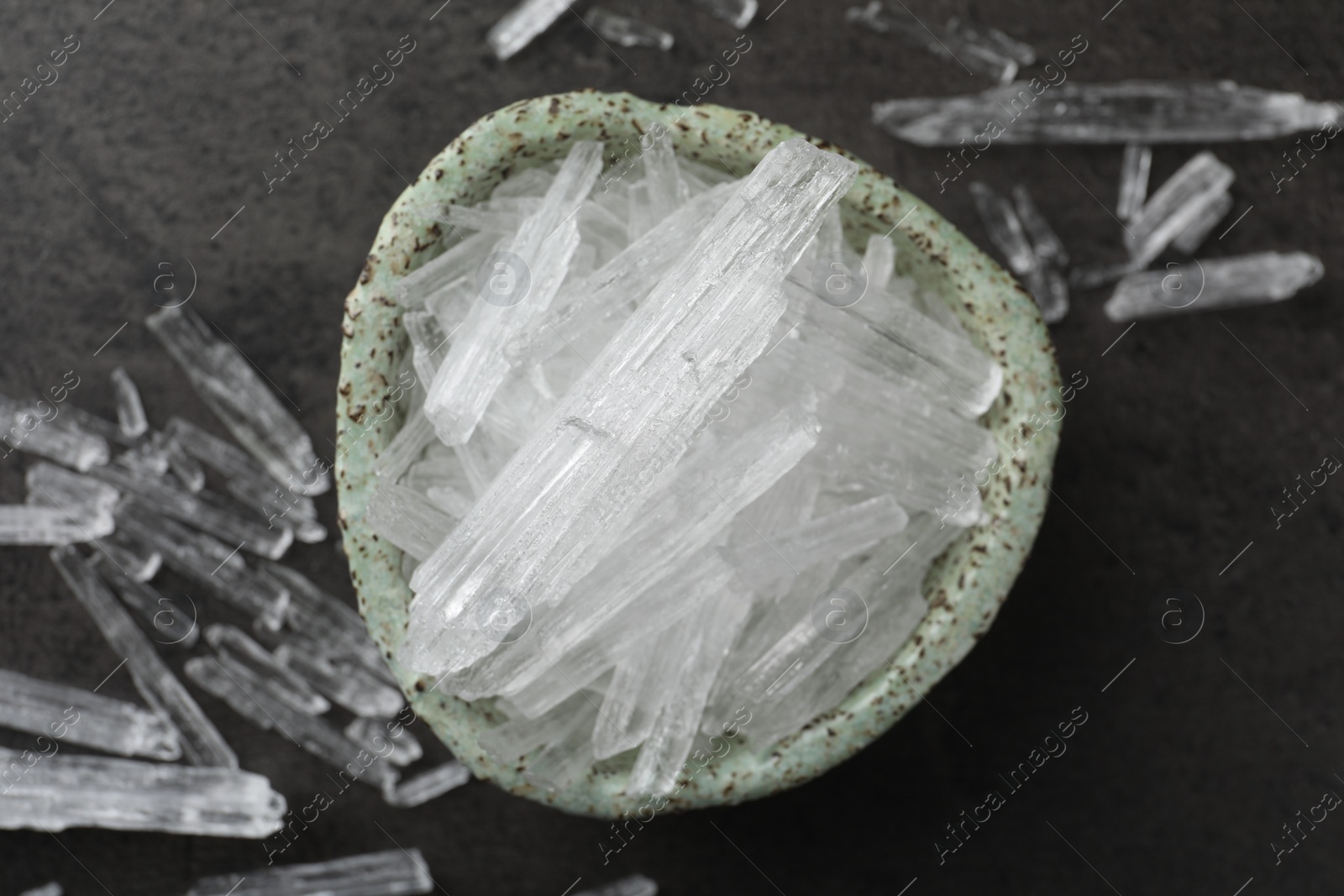 Photo of Menthol crystals on grey background, flat lay