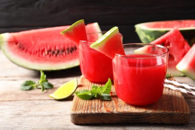 Photo of Summer watermelon drink in glasses served on table