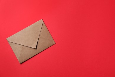 Letter envelope on red background, top view. Space for text