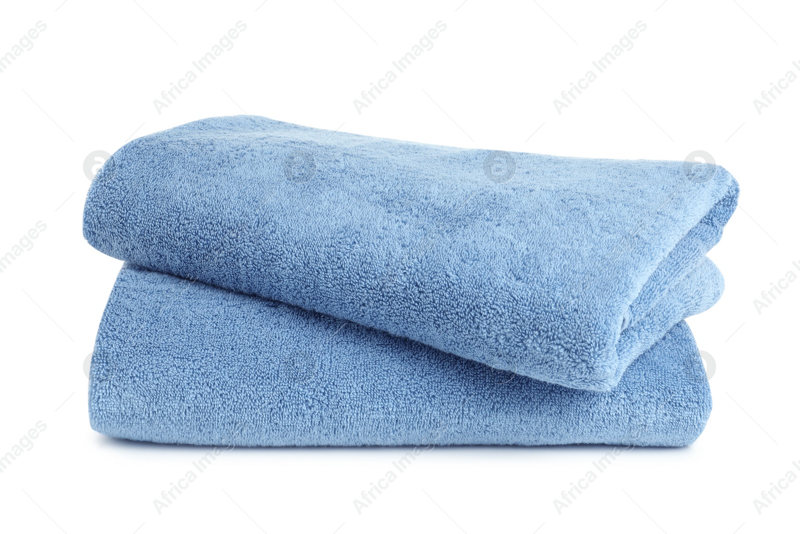 Photo of Folded clean soft towels on white background