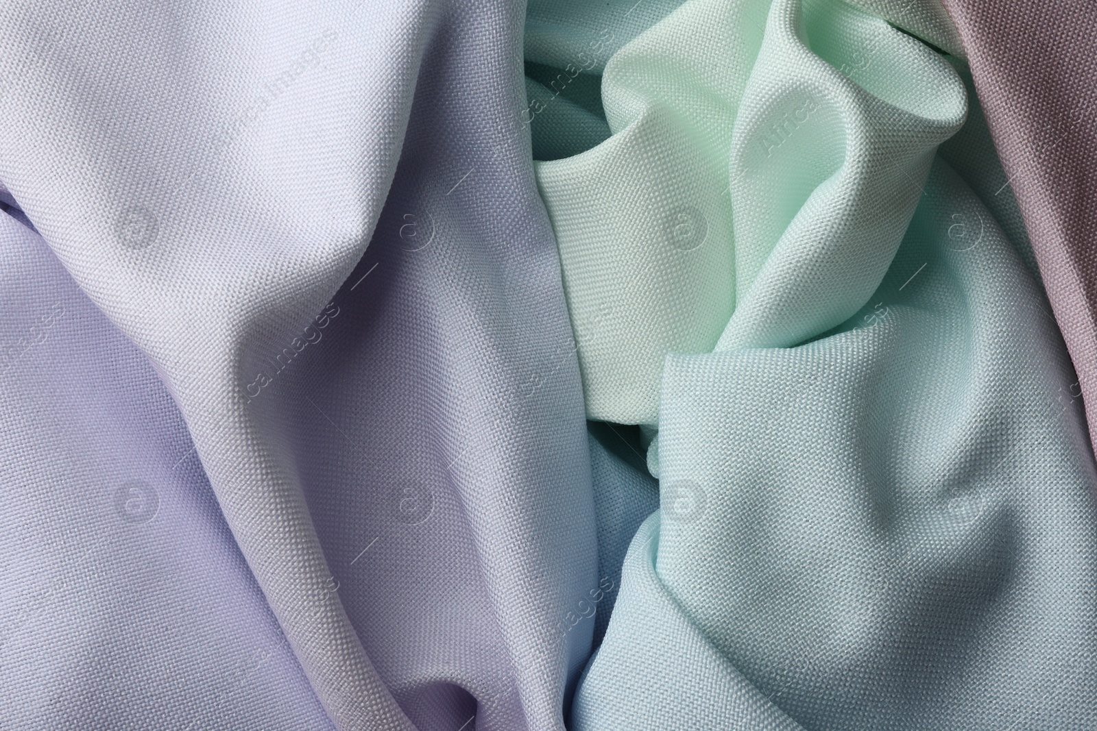 Photo of Different crumpled fabrics as background, top view