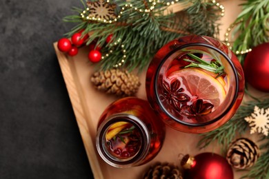 Aromatic punch drink and Christmas decor on grey table, flat lay. Space for text