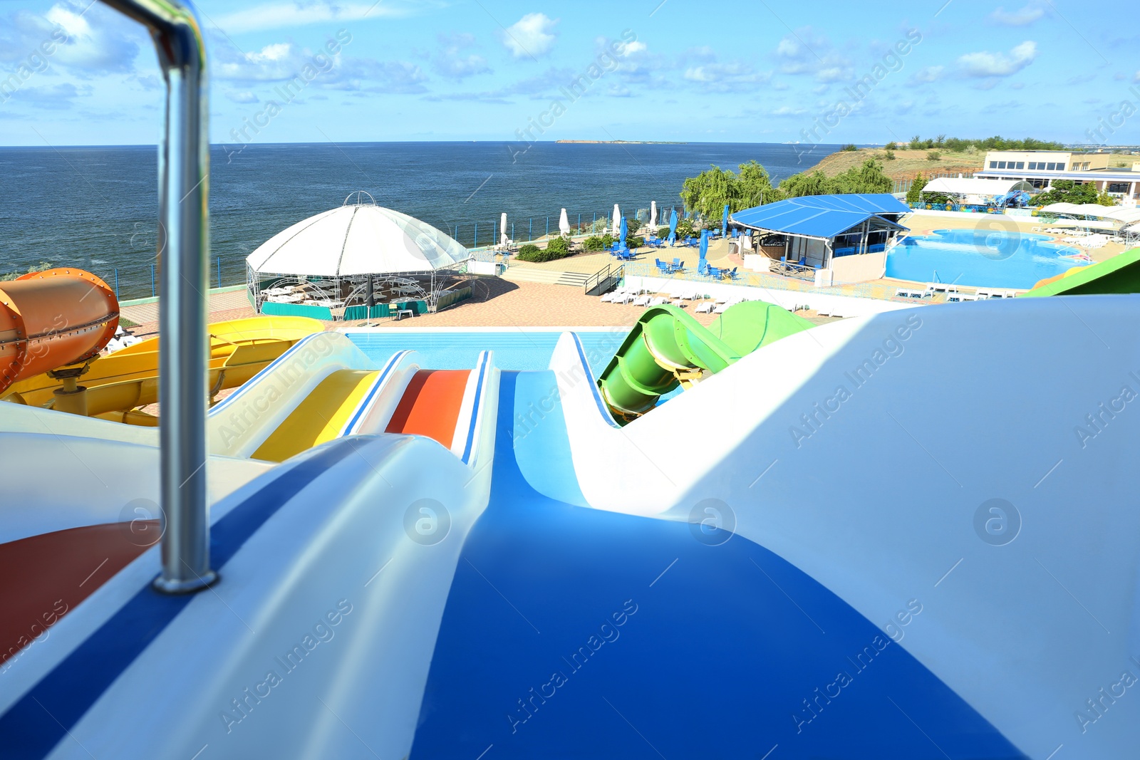 Photo of View from colorful slide in water park on sunny day