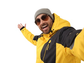 Photo of Smiling man in hat and sunglasses taking selfie on white background