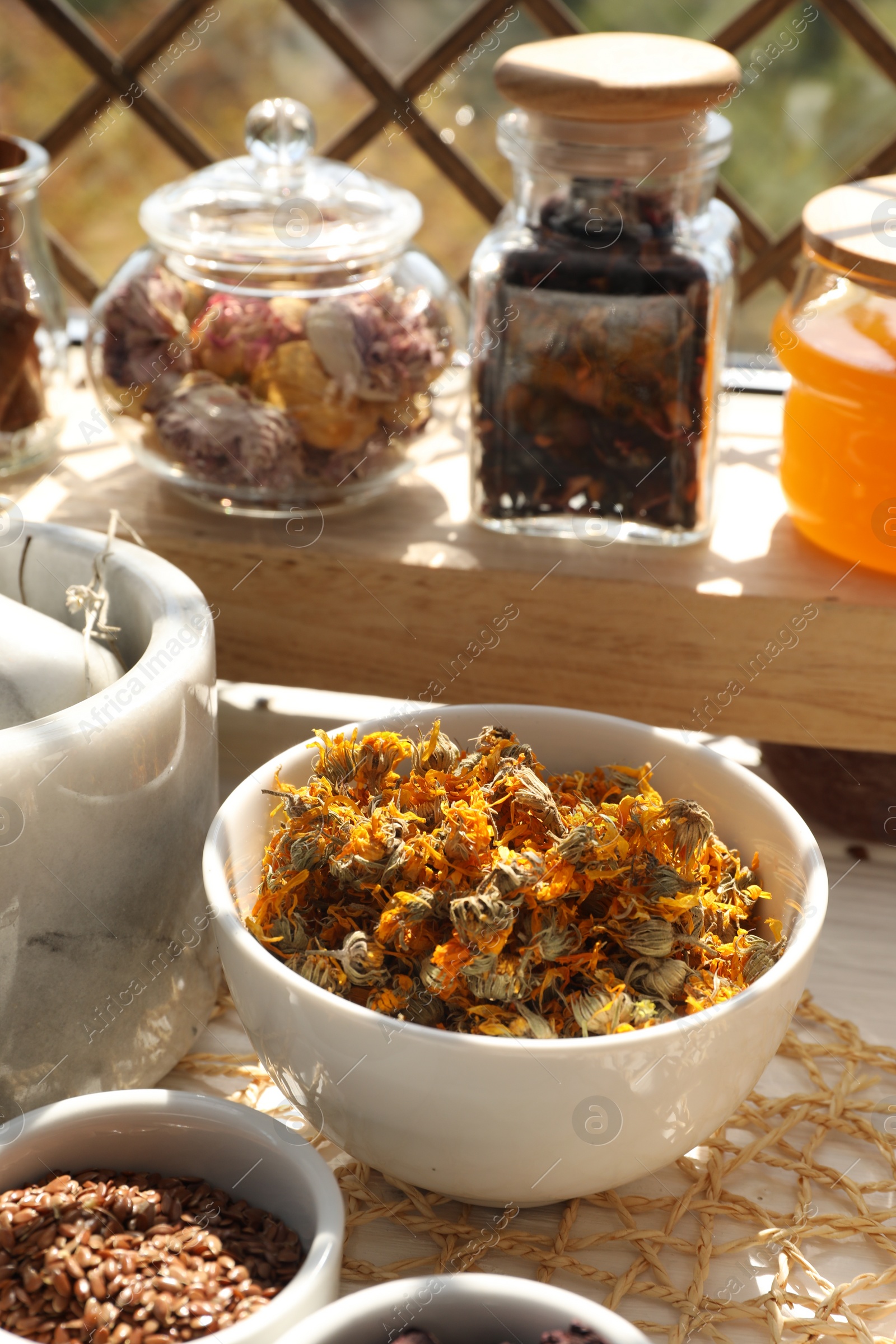 Photo of Many different dry herbs and flowers on table