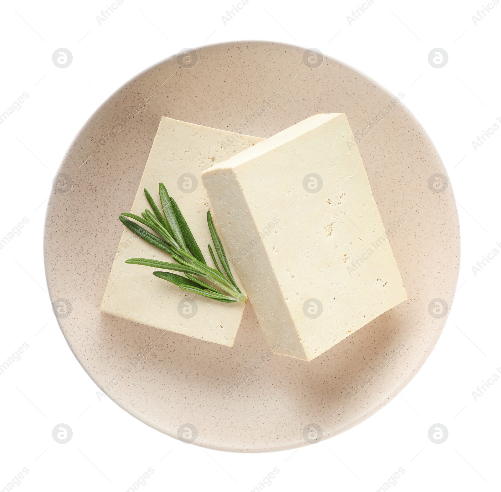 Photo of Plate with delicious raw tofu and rosemary isolated on white, top view