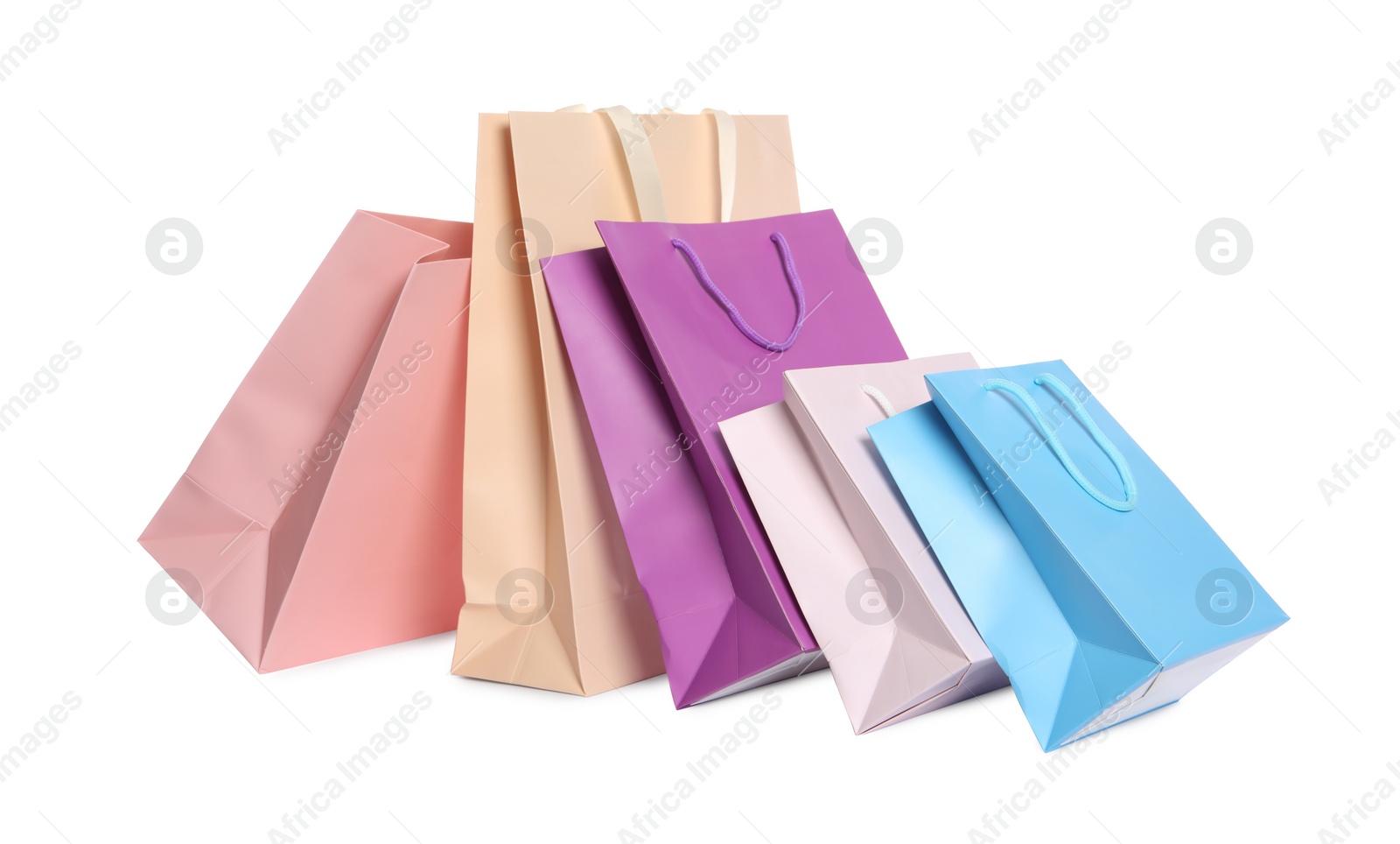 Photo of Colorful paper shopping bags isolated on white