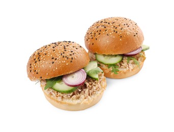 Delicious sandwiches with tuna and vegetables on white background