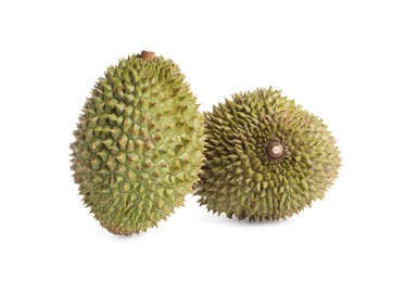 Photo of Whole ripe durian fruits on white background