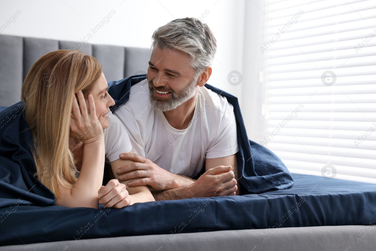 Photo of Lovely mature couple in bed at home