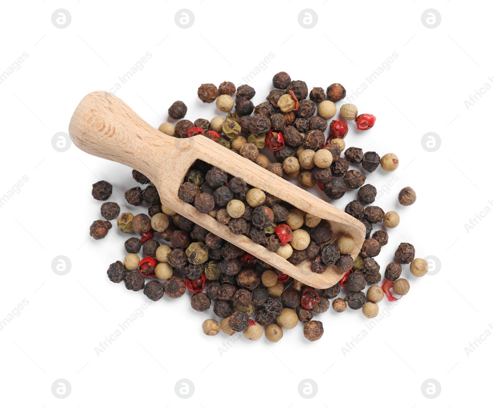 Photo of Aromatic spices. Different peppers and wooden scoop isolated on white, top view