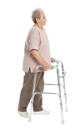 Full length portrait of elderly woman using walking frame isolated on white