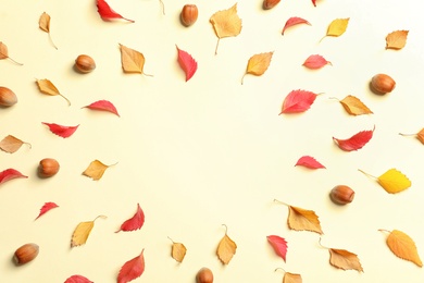 Photo of Flat lay composition with autumn leaves and space for text on color background