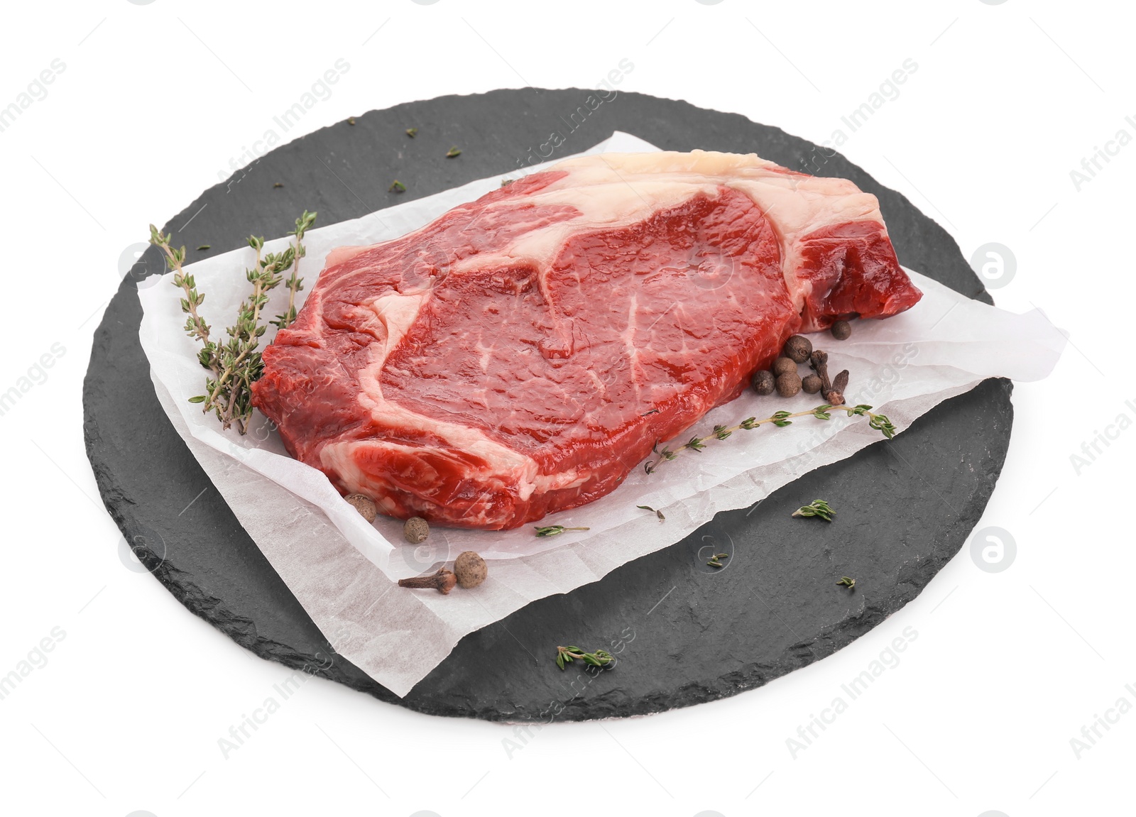 Photo of Piece of fresh beef meat, thyme and spices on white background