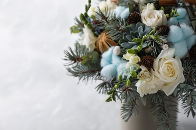 Photo of Beautiful wedding winter bouquet on light background, closeup