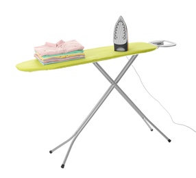 Photo of Board with modern iron and clean laundry on white background