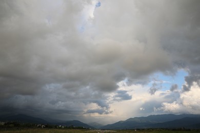 Photo of Picturesque view of sky with heavy rainy clouds