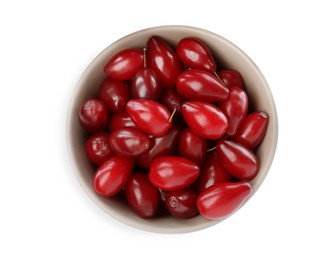 Fresh ripe dogwood berries in bowl on white background, top view