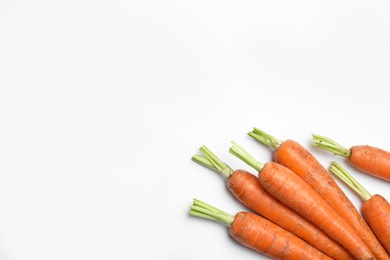 Photo of Ripe carrots isolated on white, top view