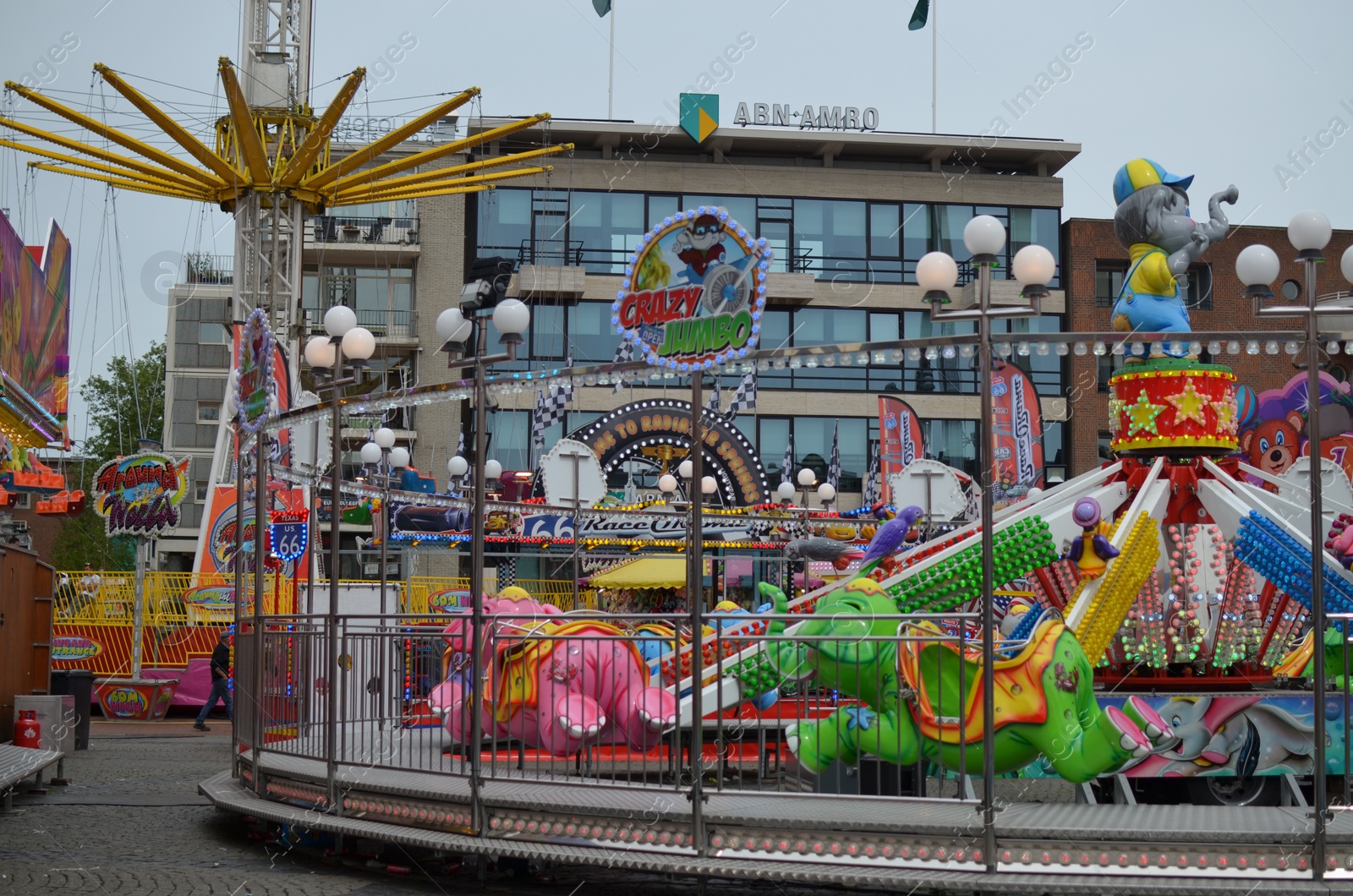 Photo of GRONINGEN, NETHERLANDS - MAY 20, 2022: Carousel attraction in outdoor amusement park