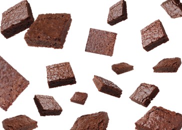 Image of Slices of delicious chocolate brownie flying on white background