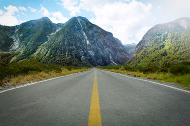 Empty asphalt road in mountains. Picturesque landscape