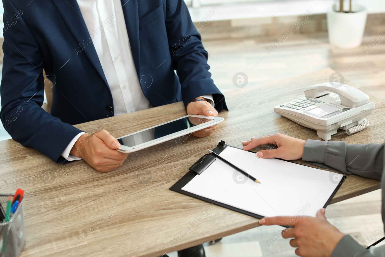 Photo of Human resources manager conducting job interview with applicant in office