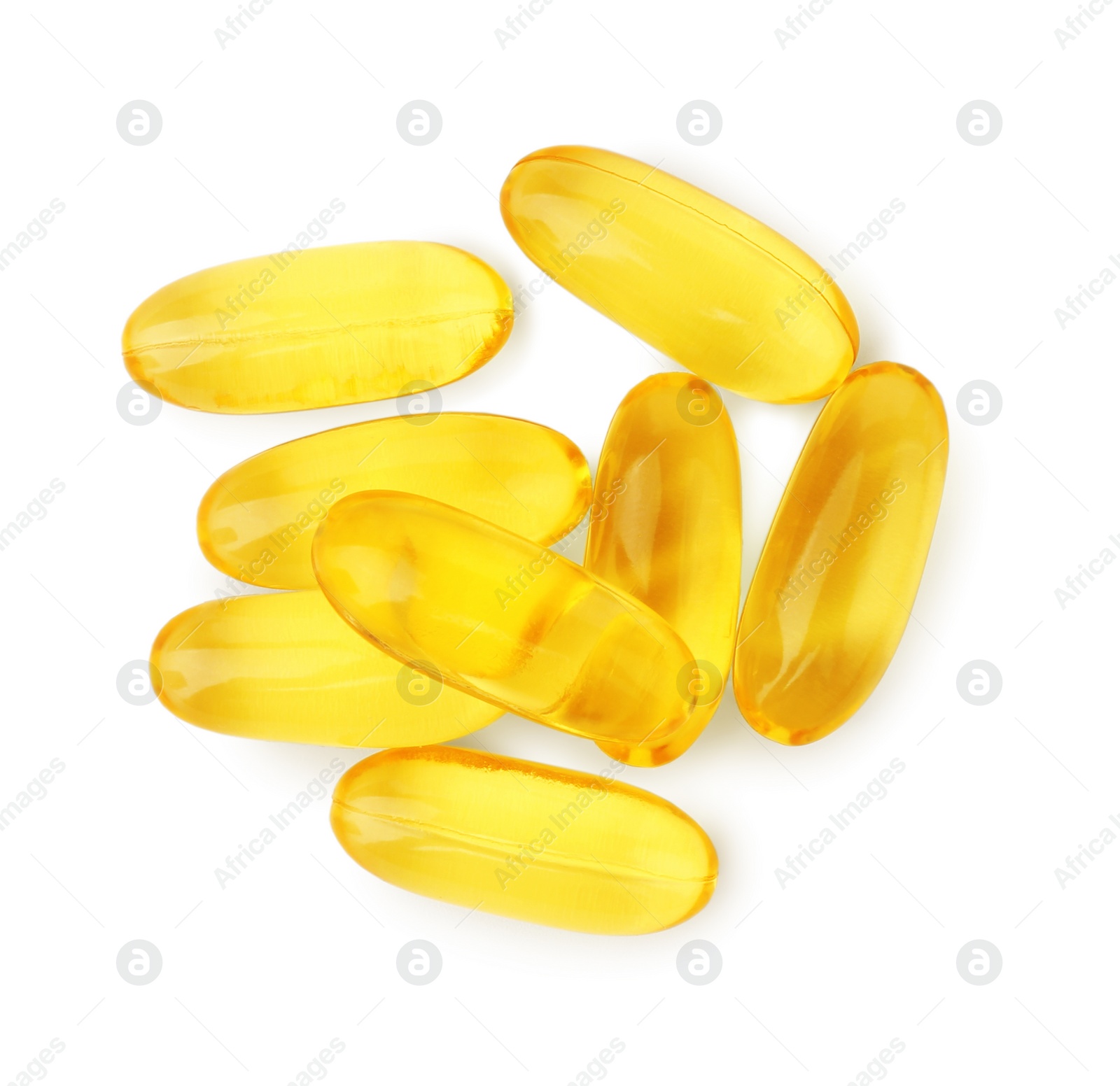 Photo of Many yellow vitamin capsules isolated on white, top view