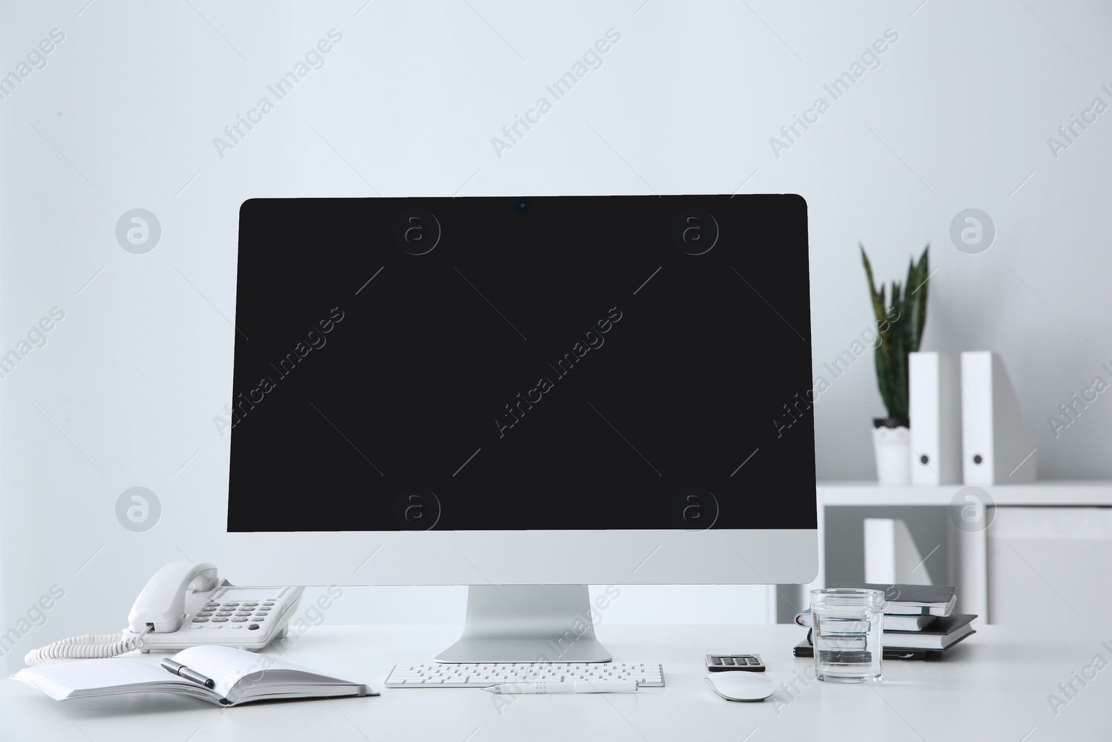 Photo of Stylish workplace with modern computer on desk