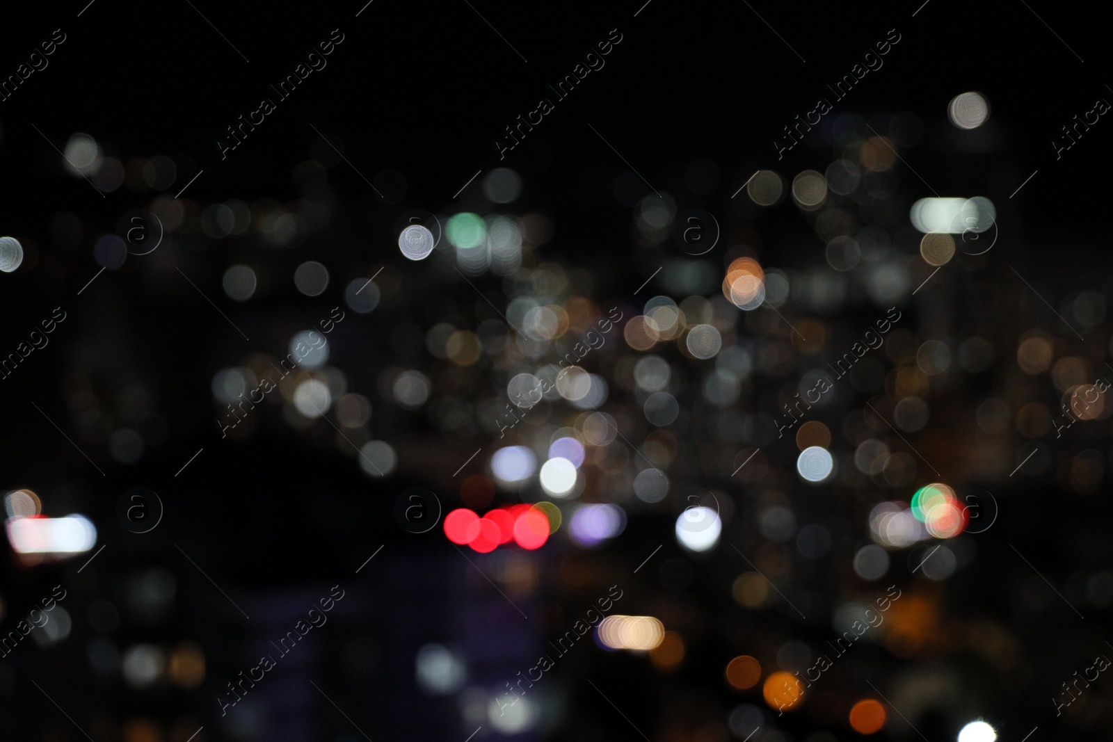 Photo of Blurred view of cityscape at night. Bokeh effect