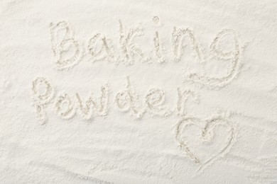 Photo of Words Baking Powder and heart written on powder, top view