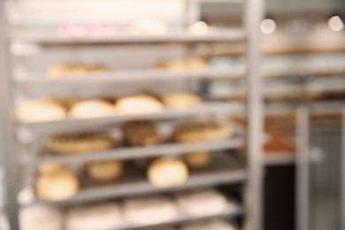 Blurred view of rack with pastries in workshop