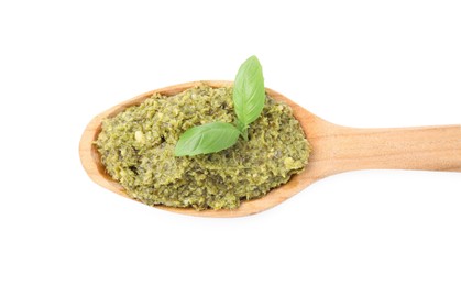 Photo of Wooden spoon with delicious pesto sauce and basil isolated on white, top view