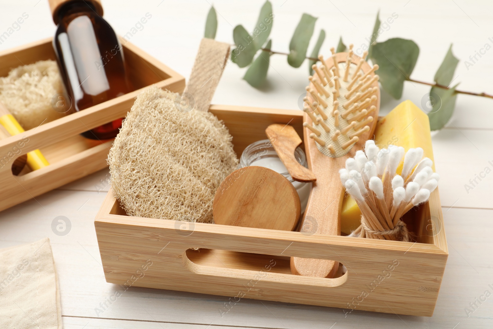 Photo of Boxes with eco friendly products on white wooden table