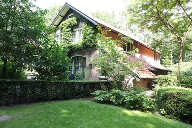 Beautiful view of house and garden on sunny day