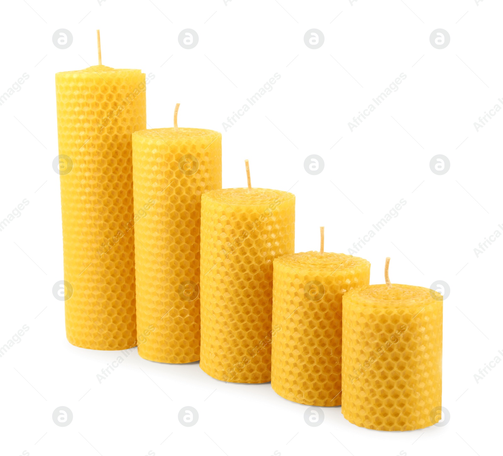 Photo of Stylish elegant beeswax candles isolated on white