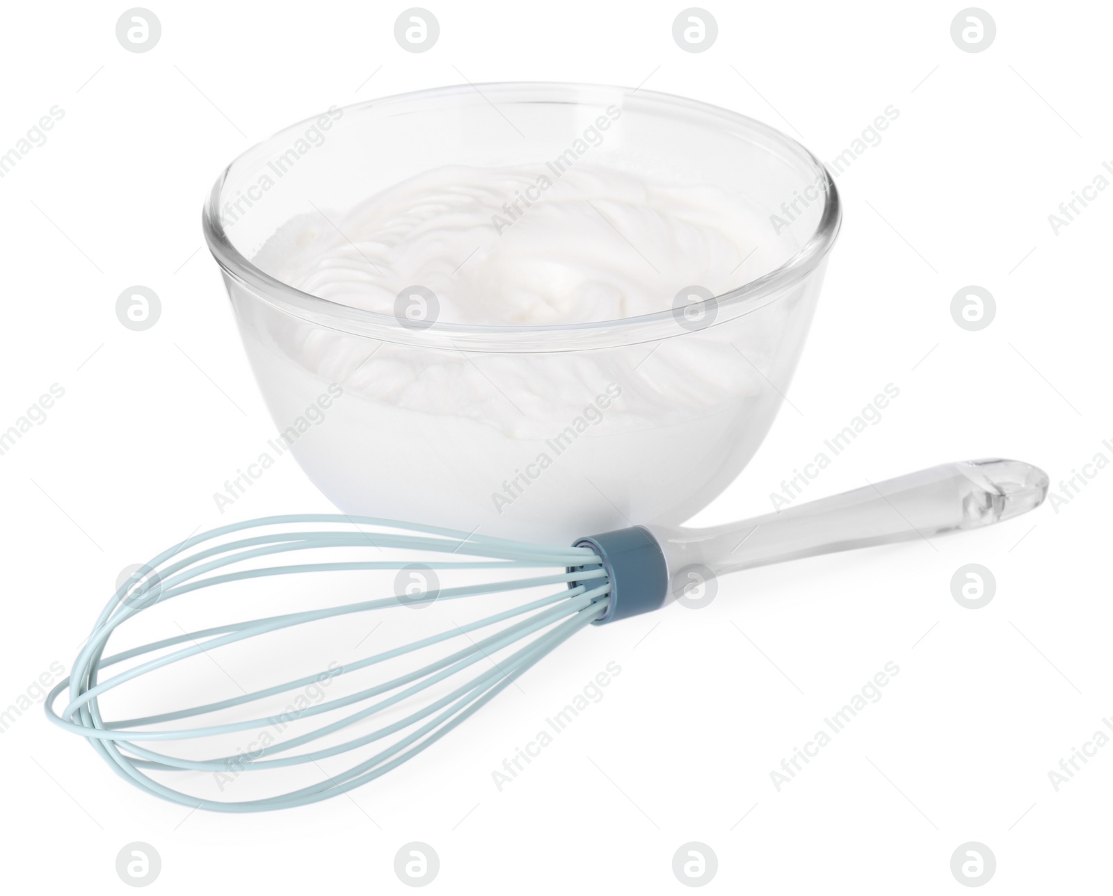 Photo of Bowl with whipped cream and whisk isolated on white