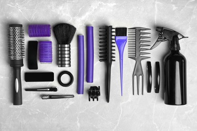 Photo of Professional hairdresser set on light background