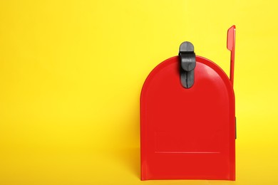 Closed red letter box on yellow background. Space for text