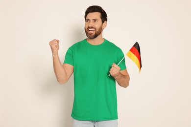Photo of Man with flag of Germany on white background