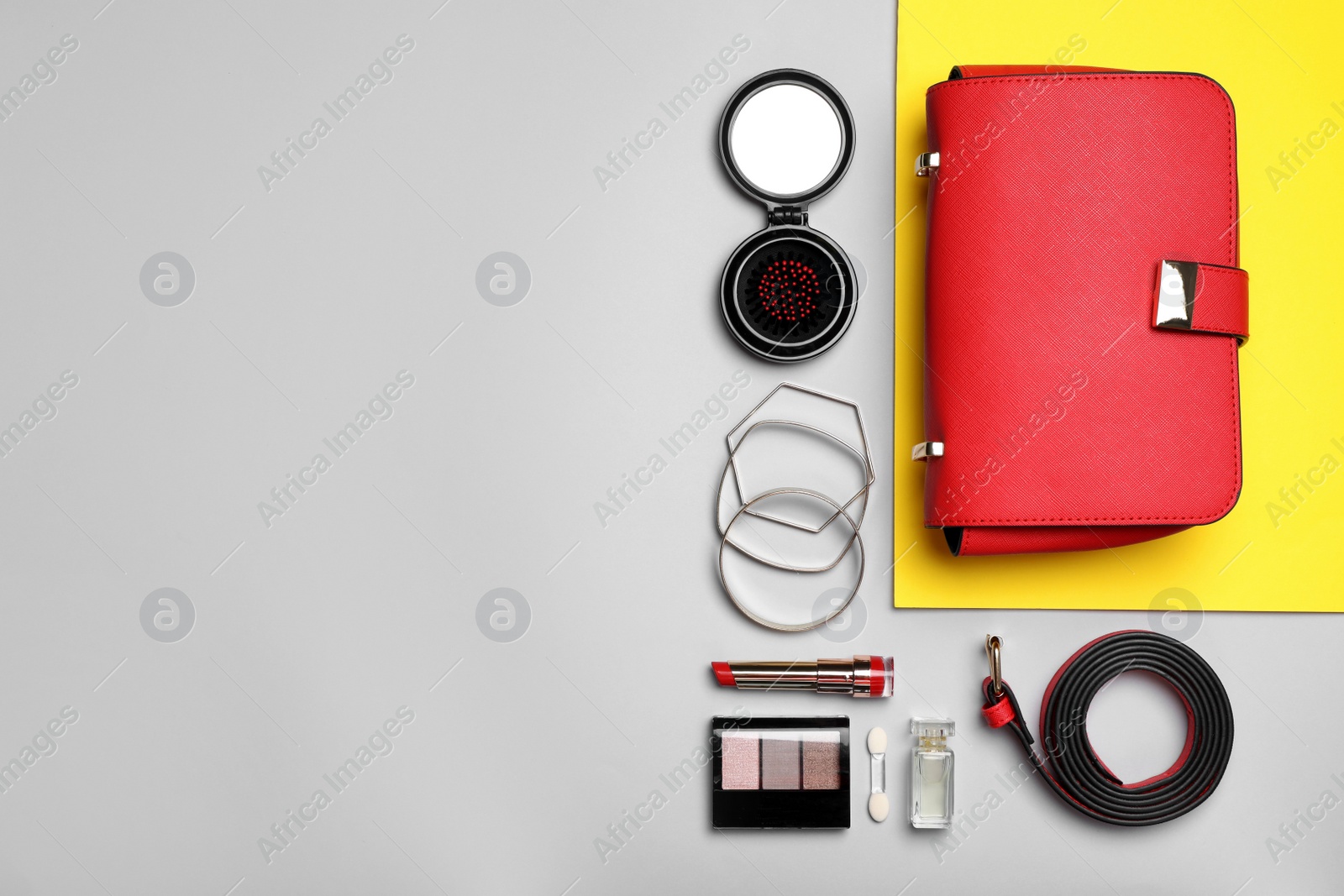 Photo of Flat lay composition with stylish woman's bag on color background. Space for text