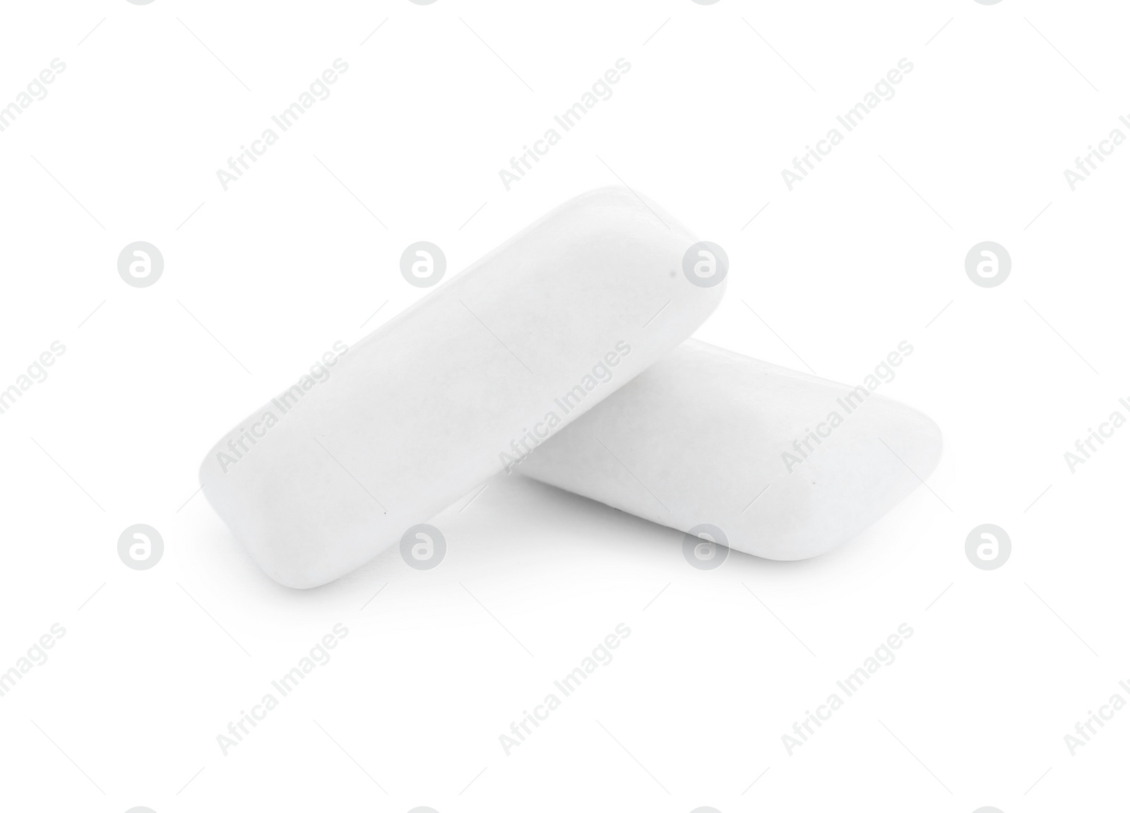 Photo of Two pieces of chewing gum on white background