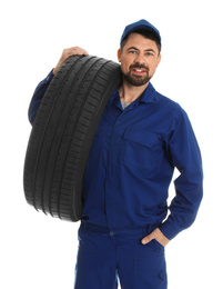 Photo of Portrait of professional auto mechanic with tire on white background
