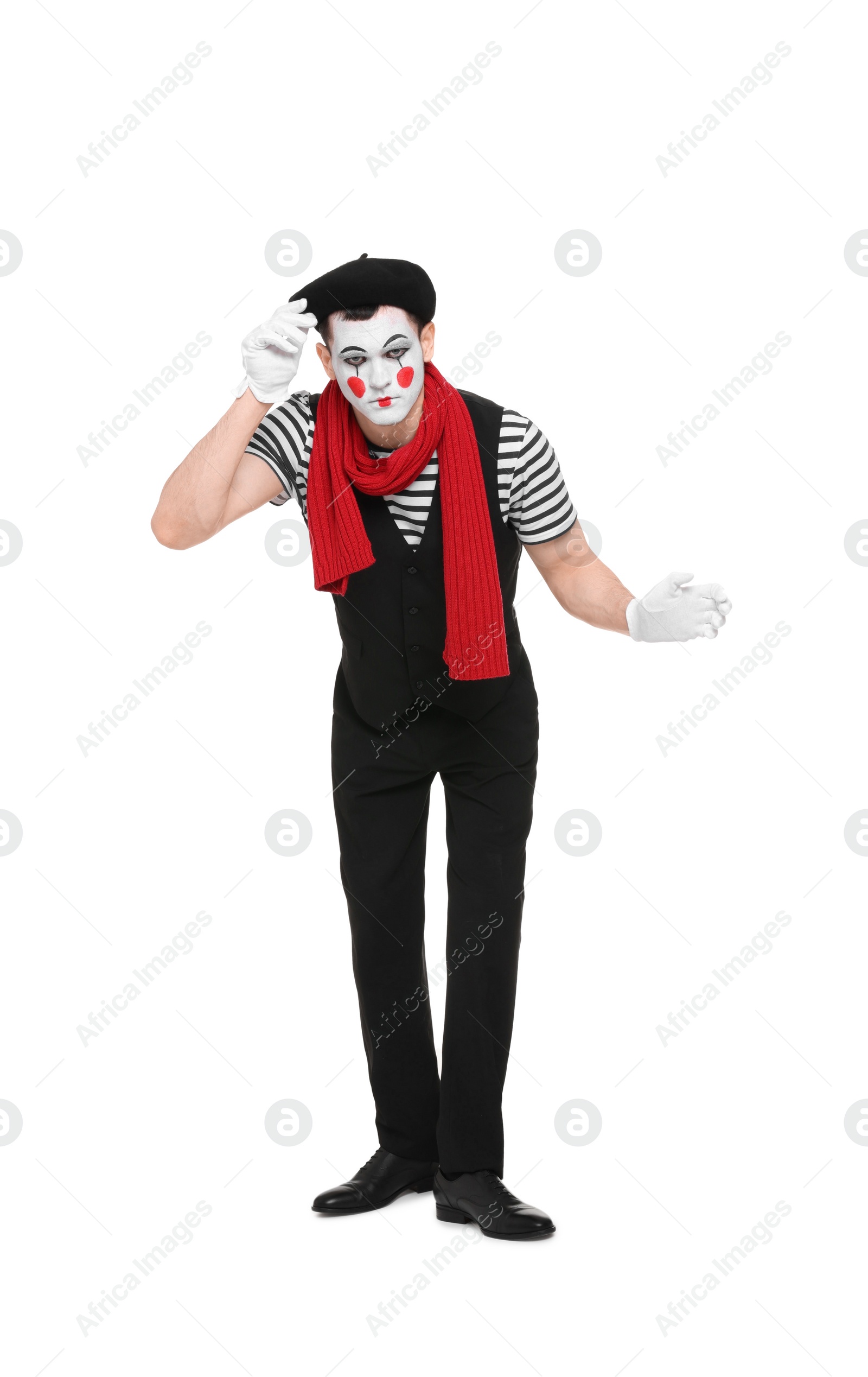 Photo of Funny mime artist in beret posing on white background