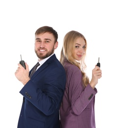 Photo of Happy young business people with car key on white background