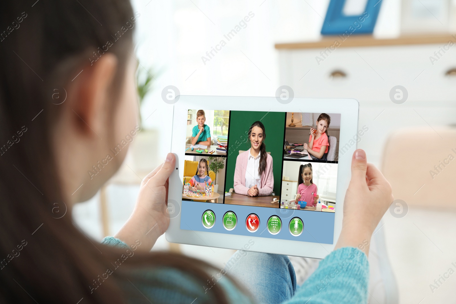 Image of Distance learning during quarantine and lockdown due to Covid-19 pandemic. Girl having online school lesson with class at home