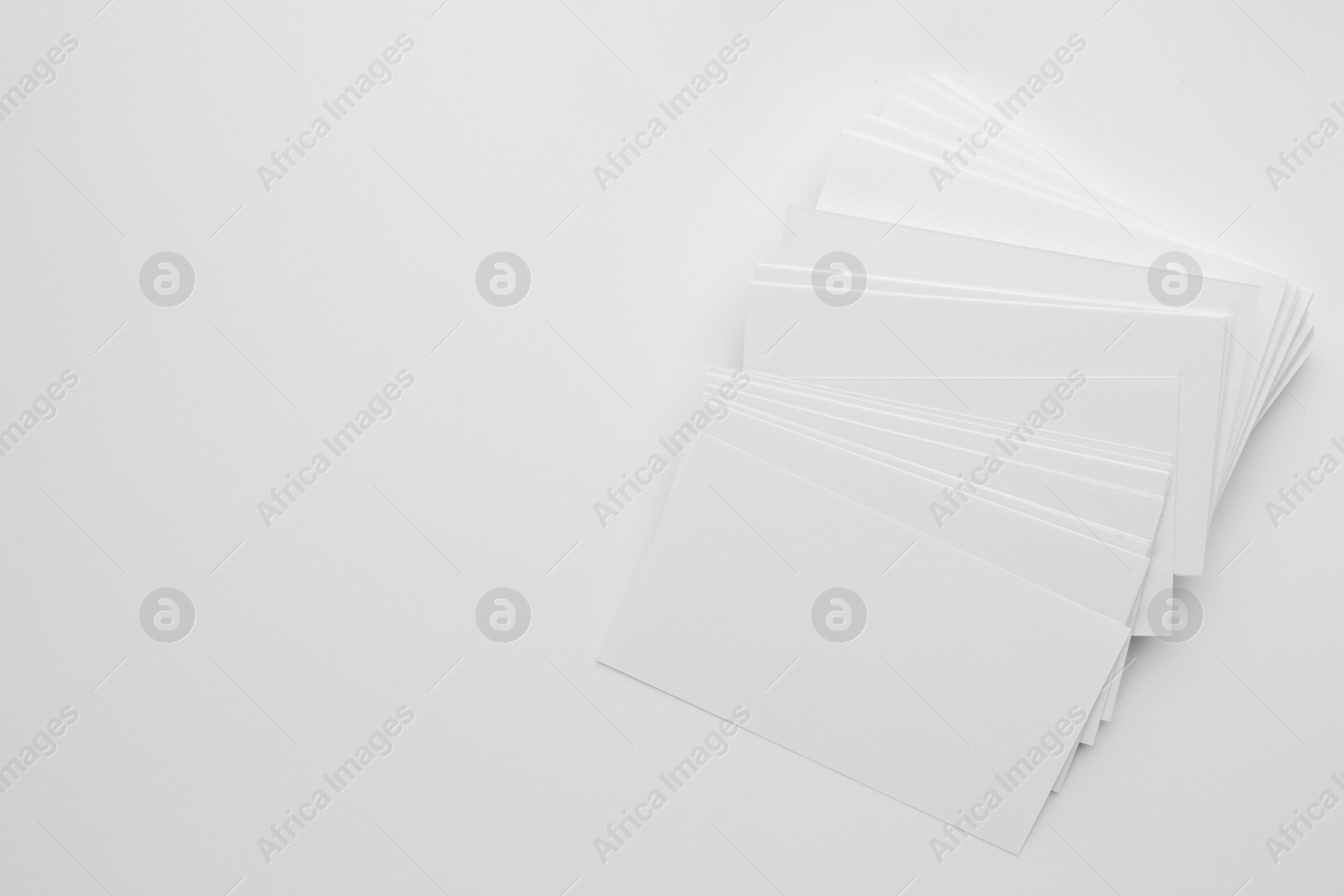 Photo of Blank business cards on white background, top view. Space for text