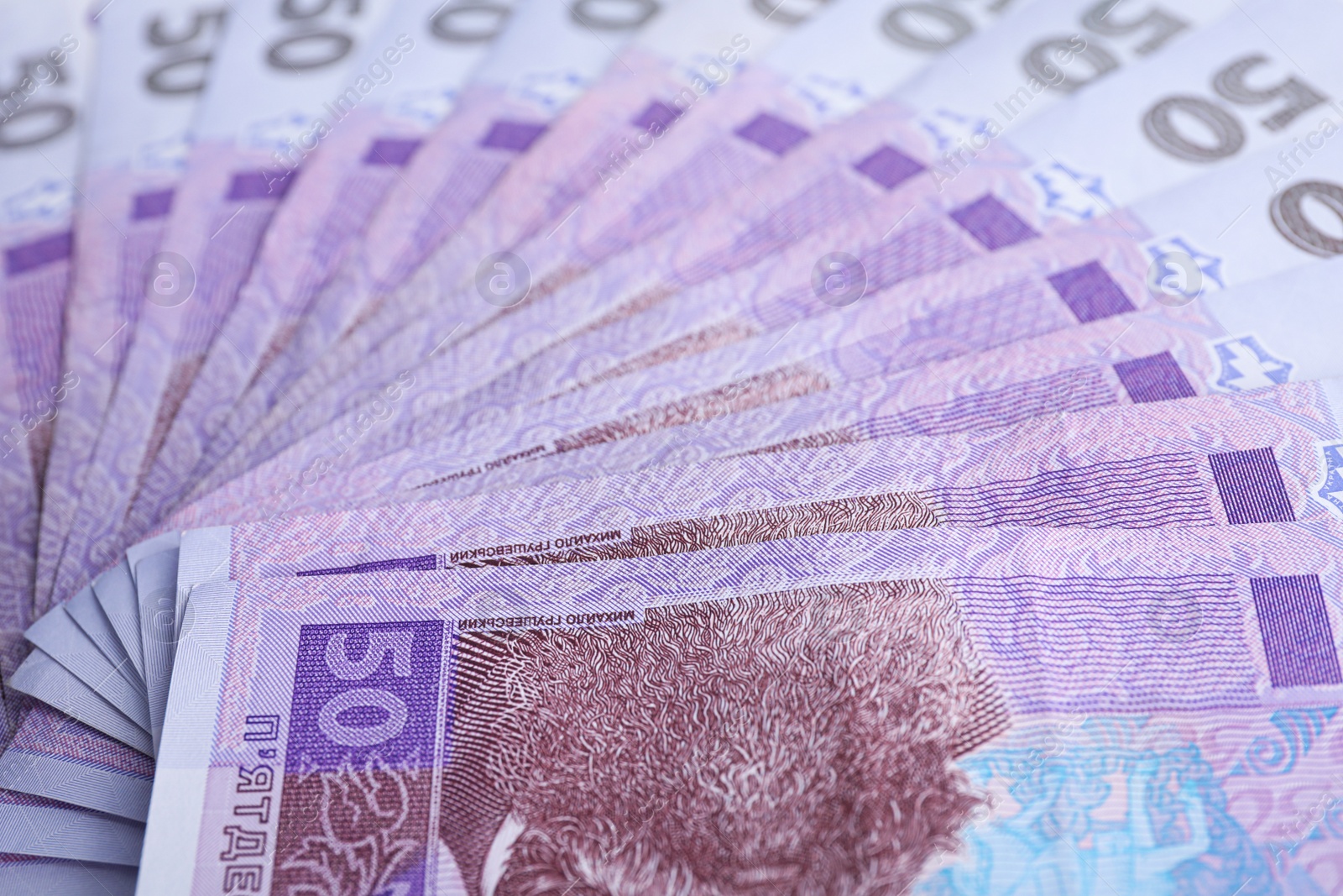 Photo of Closeup view of Ukrainian money as background. National currency