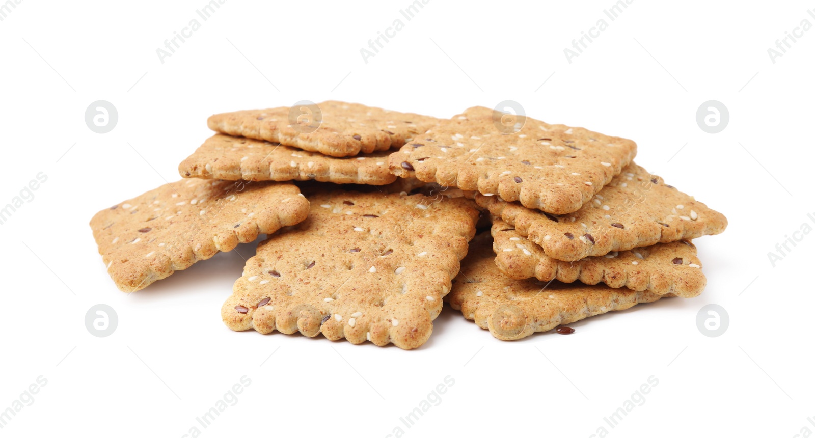 Photo of Pile of cereal crackers with flax and sesame seeds isolated on white