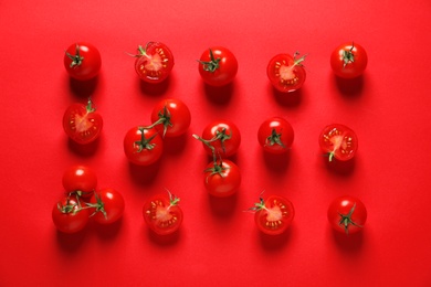 Photo of Flat lay composition with ripe cherry tomatoes on color background